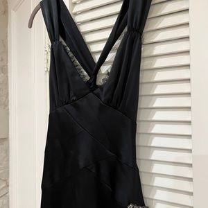 ABS black cocktail dress with asymmetrical hem and twist back